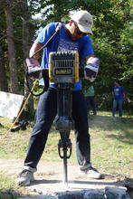 Jackhammering a sidewalk. 