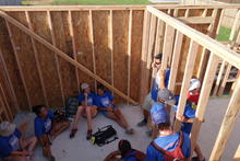 Huddling under a wall for shade